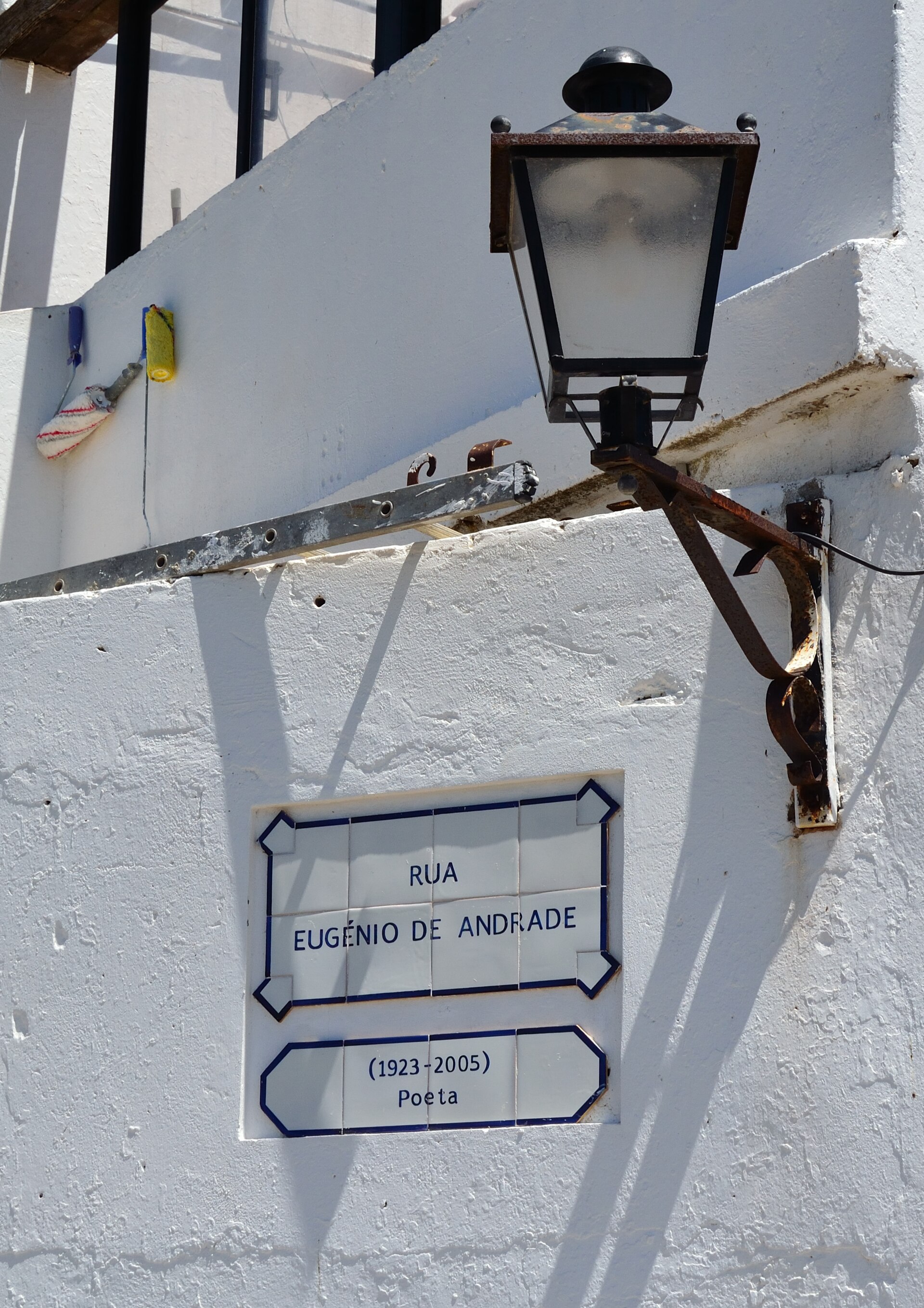 A traditional lantern and whitewashed walls in Cacela Velha