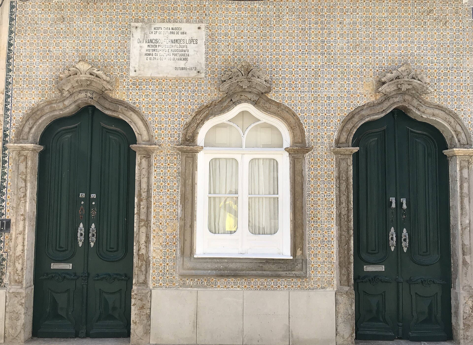Ornate doorways and traditional architecture in Olhão